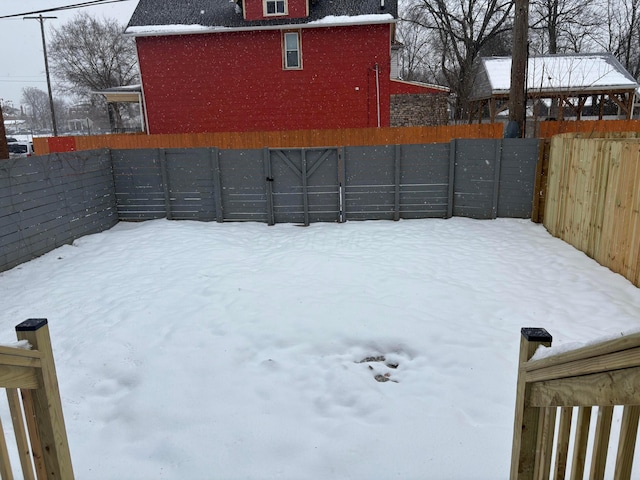 view of yard layered in snow