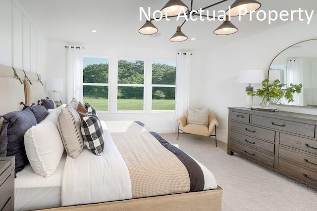 bedroom with light colored carpet