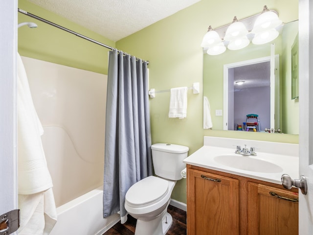 full bathroom with shower / tub combo, wood-type flooring, toilet, vanity, and a textured ceiling