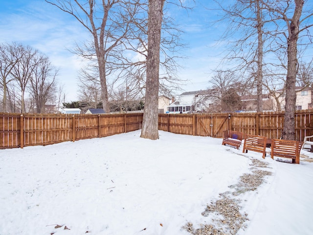 view of yard layered in snow