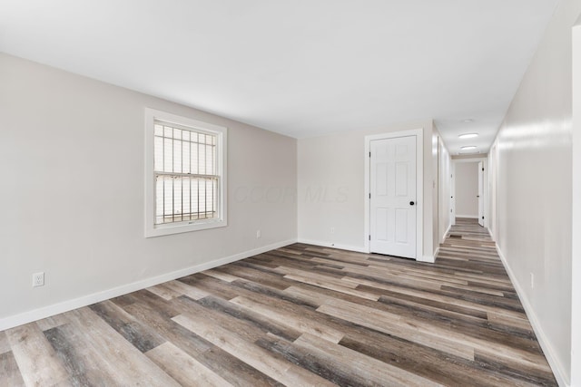 spare room featuring dark hardwood / wood-style flooring