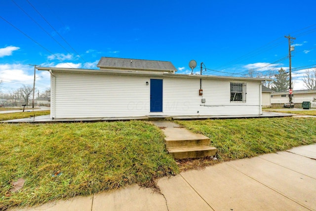 rear view of house with a lawn