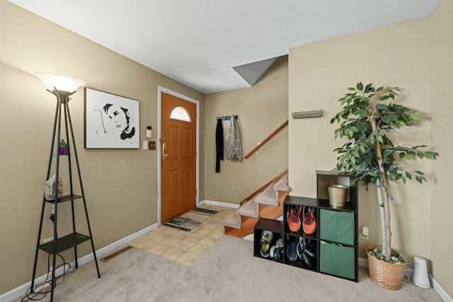 view of carpeted foyer