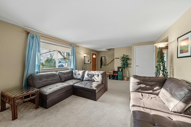 living room featuring light carpet