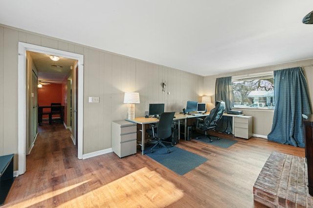 office featuring hardwood / wood-style flooring and ceiling fan