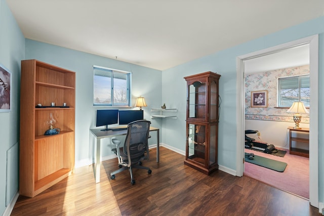 home office with dark hardwood / wood-style floors