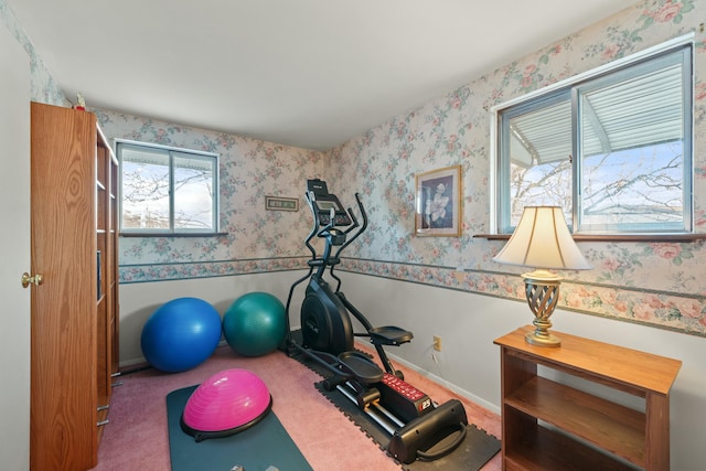 workout room featuring dark colored carpet