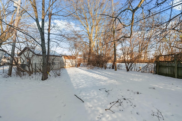 view of yard layered in snow