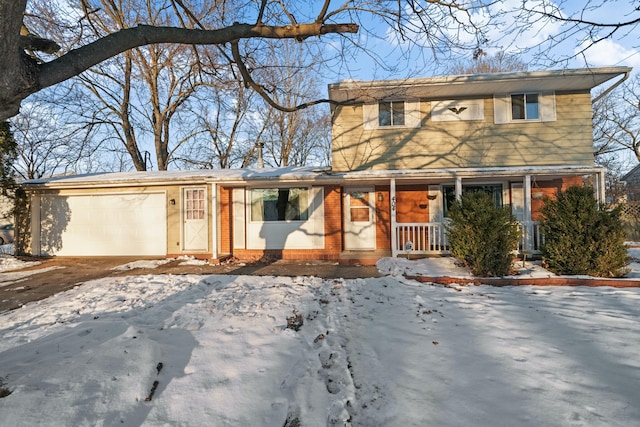 view of front of house with a garage and covered porch