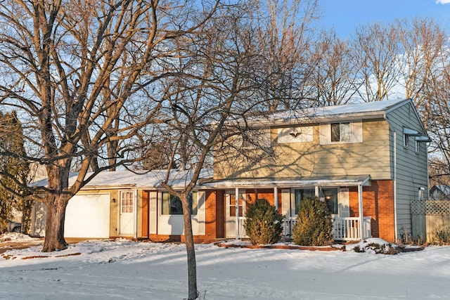 view of front of house featuring a porch and a garage