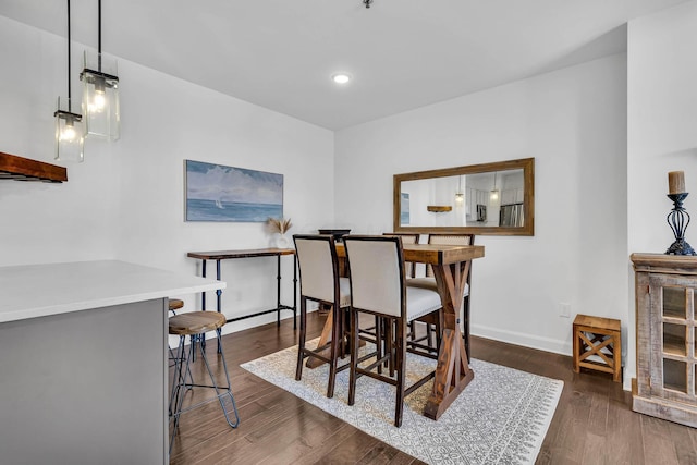 dining space featuring dark hardwood / wood-style flooring