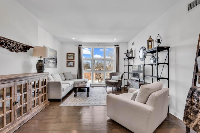 living room with dark hardwood / wood-style floors