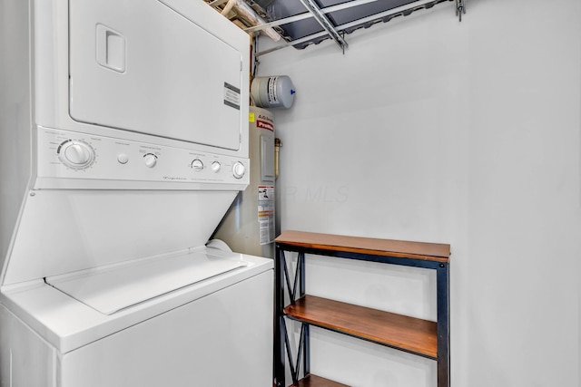 laundry room with stacked washing maching and dryer