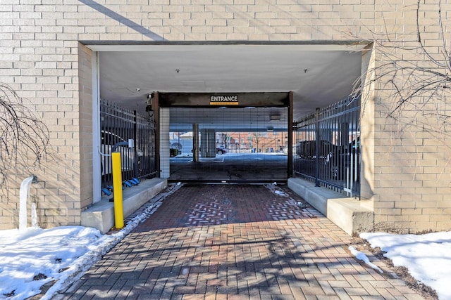 view of snow covered property entrance