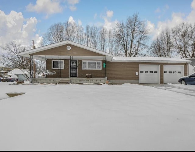 view of front of house with a garage and a porch