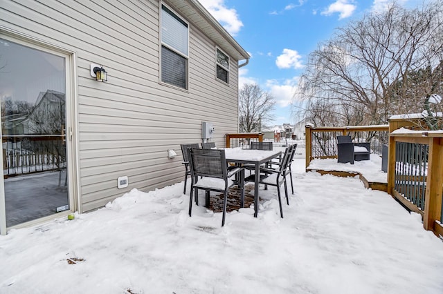 view of snow covered deck