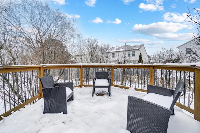 view of snow covered deck