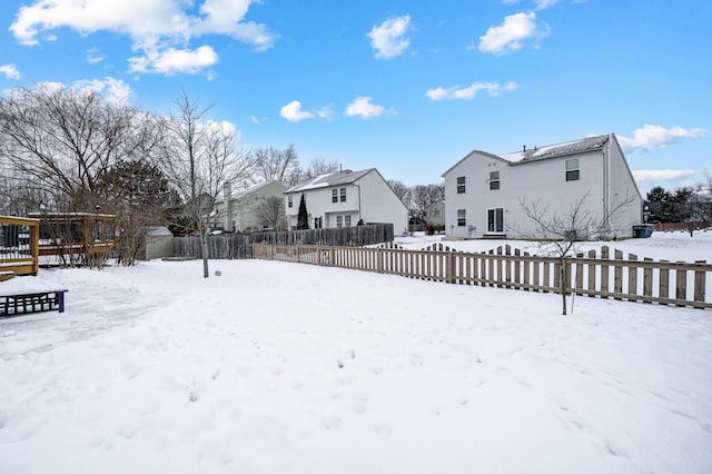 view of yard layered in snow