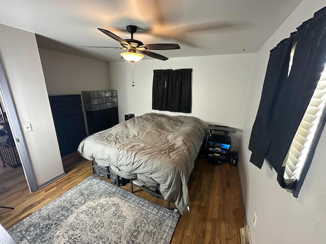 bedroom featuring hardwood / wood-style flooring and ceiling fan