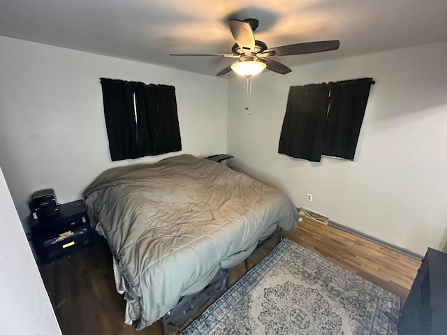 bedroom with ceiling fan and hardwood / wood-style floors