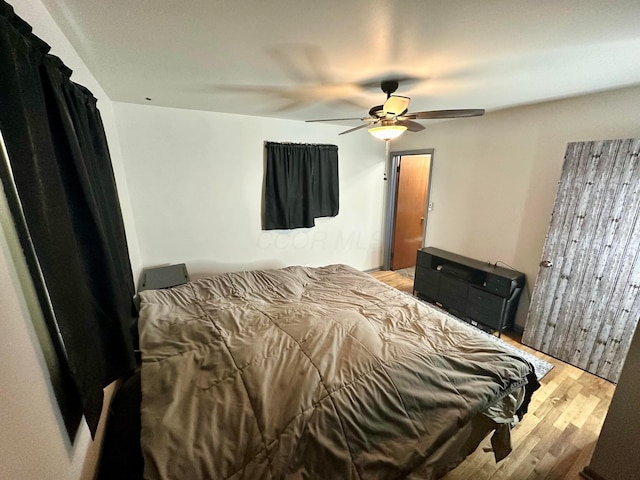 bedroom featuring ceiling fan and light hardwood / wood-style flooring