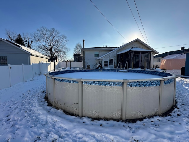 view of snow covered pool