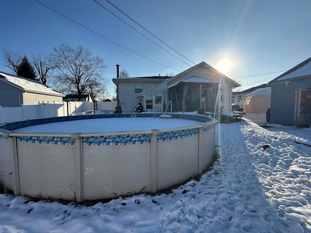 view of snow covered pool