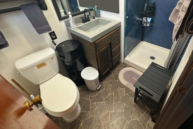 bathroom featuring toilet, curtained shower, and vanity