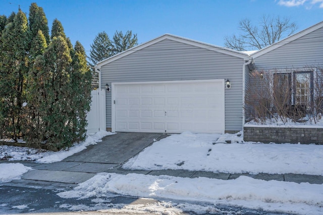 view of snow covered garage