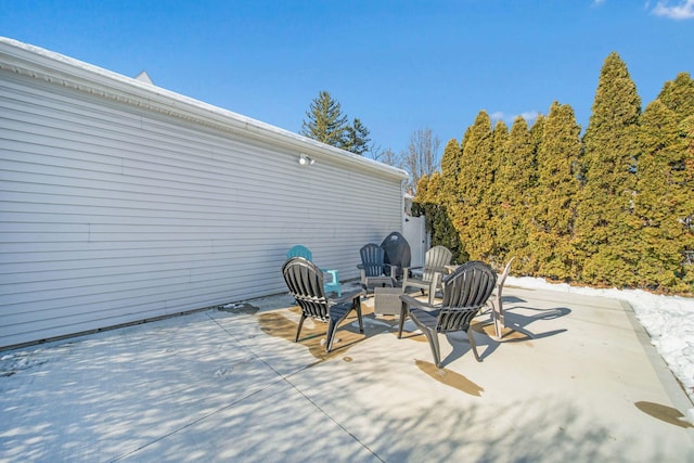 view of patio / terrace with an outdoor fire pit