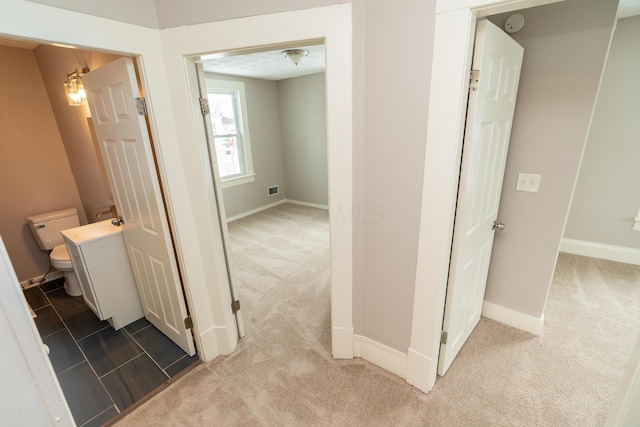 corridor featuring carpet flooring