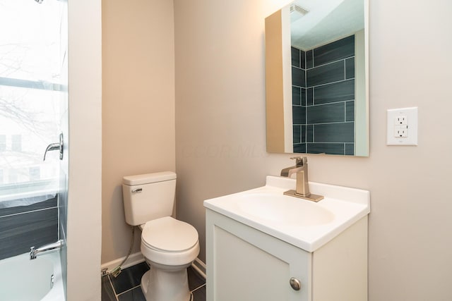 full bathroom featuring toilet, tile patterned flooring,  shower combination, and vanity