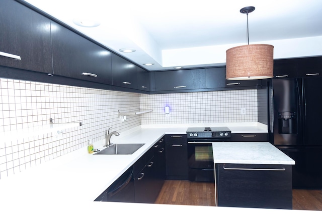 kitchen featuring black appliances, a center island, pendant lighting, sink, and tasteful backsplash