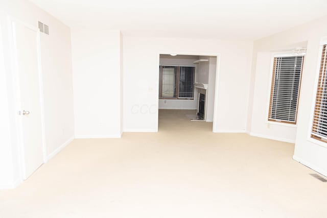 empty room featuring light carpet