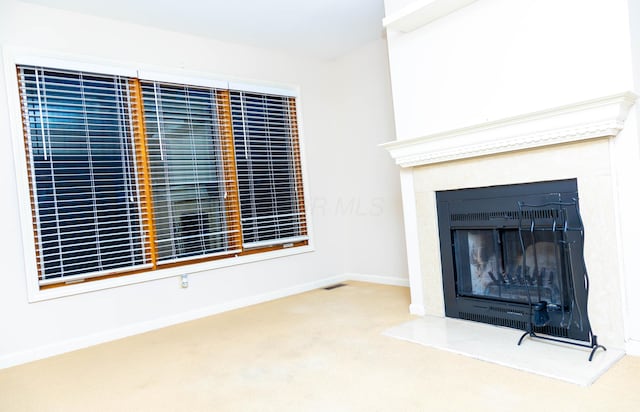 unfurnished living room with carpet flooring