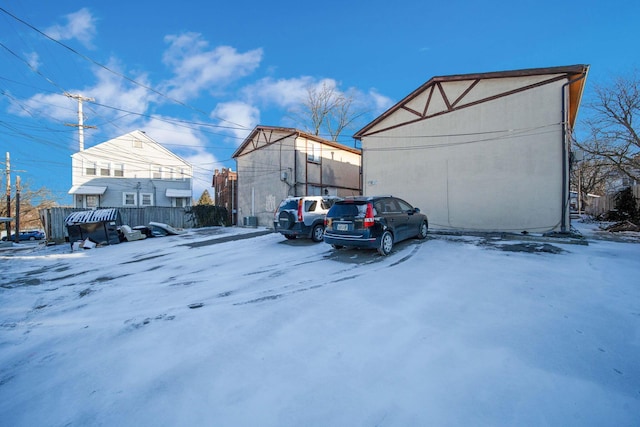 view of snow covered parking