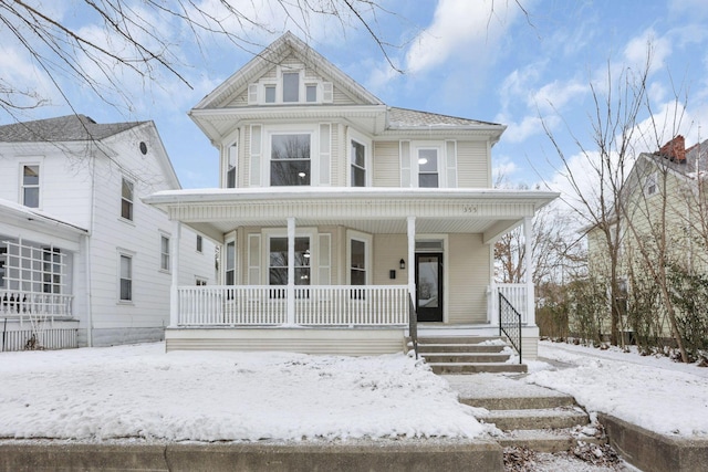 victorian-style house with a porch