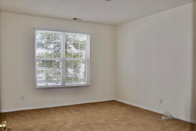 unfurnished room featuring light colored carpet