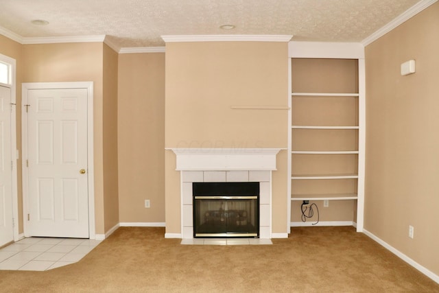 unfurnished living room featuring a textured ceiling, a tile fireplace, light colored carpet, and ornamental molding