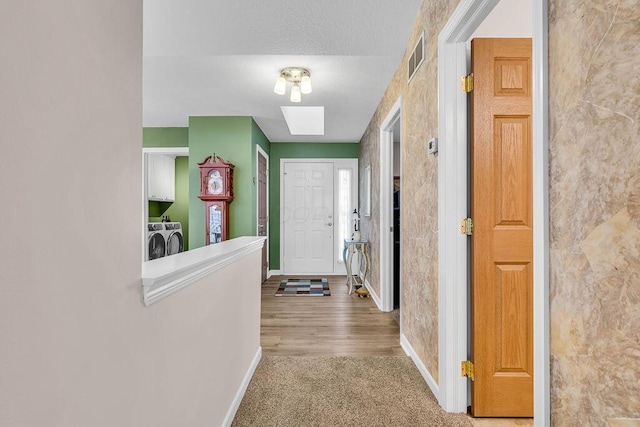 interior space with separate washer and dryer and carpet flooring