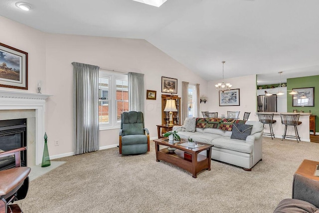 carpeted living room featuring lofted ceiling and an inviting chandelier