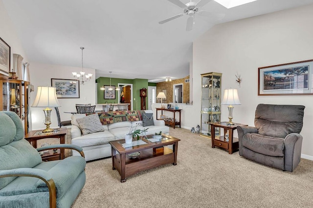 carpeted living room with lofted ceiling and ceiling fan with notable chandelier