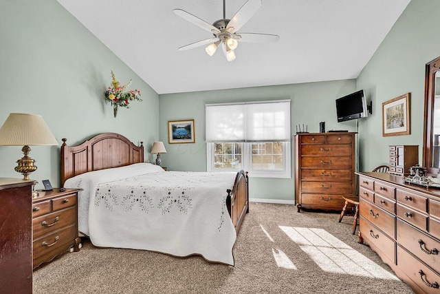 bedroom featuring ceiling fan, light carpet, and lofted ceiling