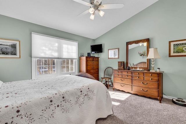 bedroom with ceiling fan, light colored carpet, and lofted ceiling