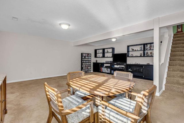 view of carpeted dining space