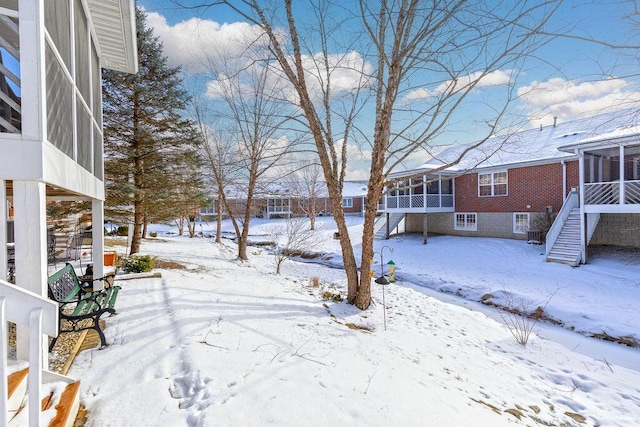 view of yard layered in snow