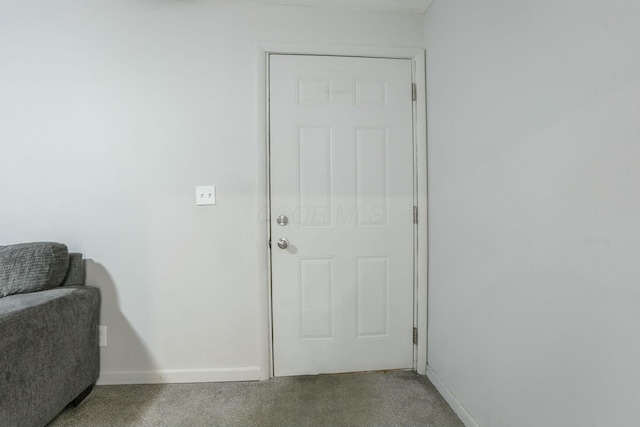 entryway featuring carpet flooring