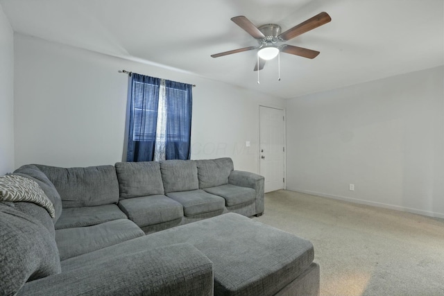 living room featuring ceiling fan and light colored carpet