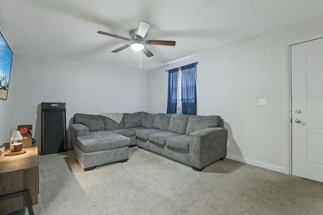 carpeted living room featuring ceiling fan