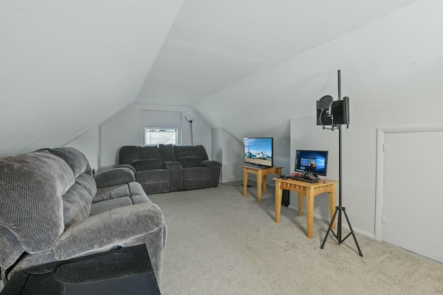 carpeted living room featuring lofted ceiling